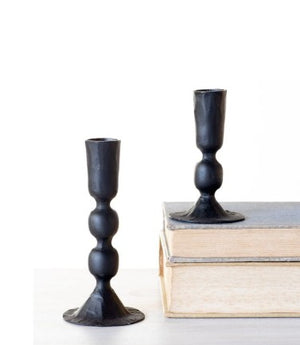 black metal candle holders on plain white background
