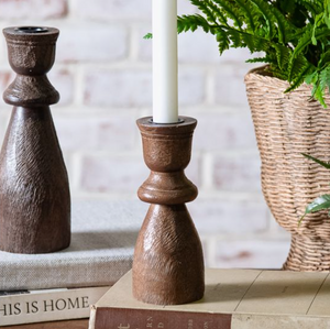 6-inch dark teakwood taper candle holder with carved natural wood finish.