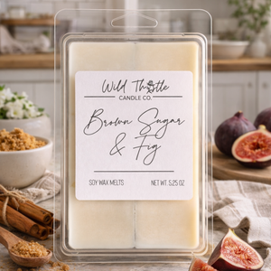 Wax melts packaging with 'Wild Thistle Candle Co.' label, surrounded by figs and cinnamon sticks.