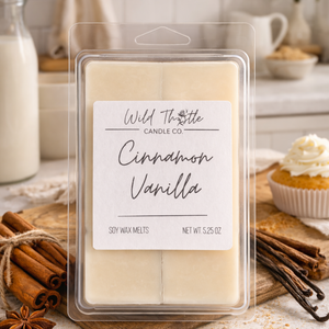 Cinnamon Vanilla soy wax melts packaging with 'Wild Thistle Candle Co.' label, surrounded by cinnamon sticks and a cupcake.